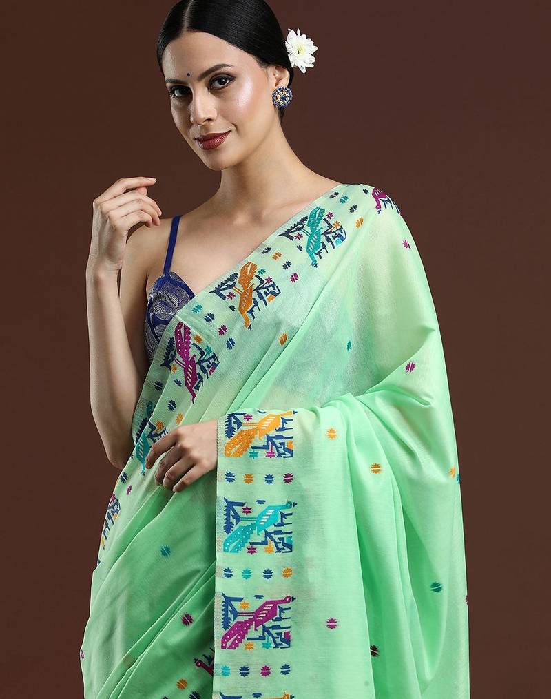 green woven design zari muga saree