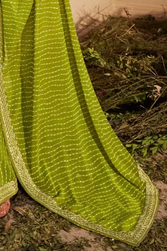 green embroidered leheriya saree
