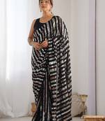 black striped sequinned saree with unstitched blouse piece