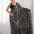 black striped sequinned saree with unstitched blouse piece