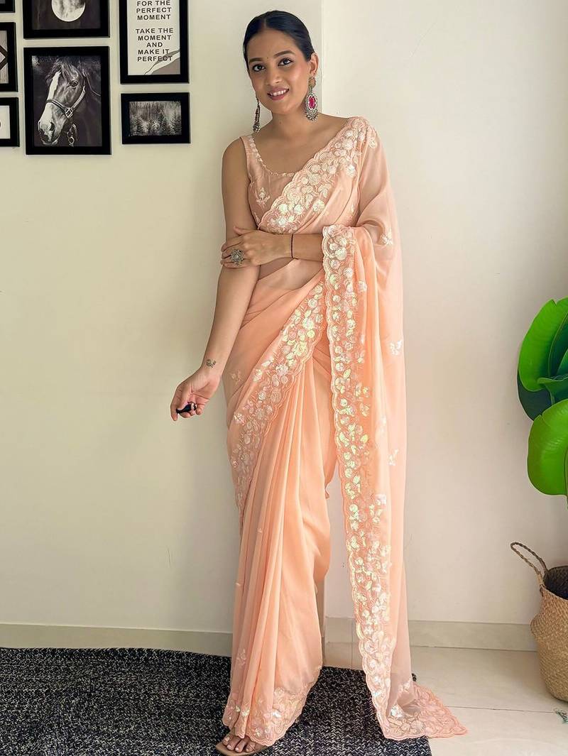 peach sequinned poly georgette saree  with blouse piece
