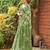 green geometric printed beads and stones pure georgette saree