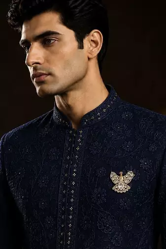 Gold plated white stone peacock motif brooch