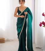Teal sequinned satin saree