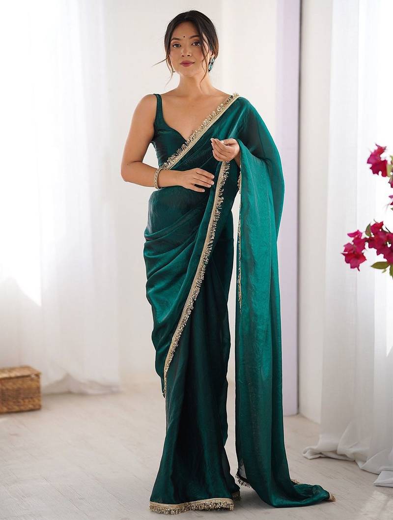 Teal sequinned satin saree