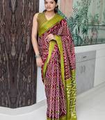 Maroon ethnic motifs printed designer ikat saree