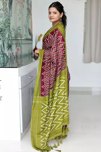 Maroon ethnic motifs printed designer ikat saree