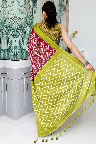 Maroon ethnic motifs printed designer ikat saree