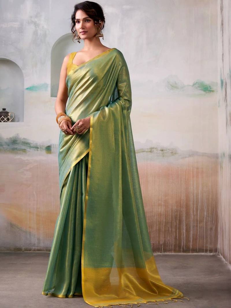 Green solid zari saree with blouse piece