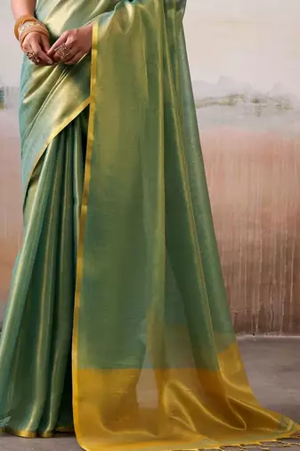 Green solid zari saree with blouse piece