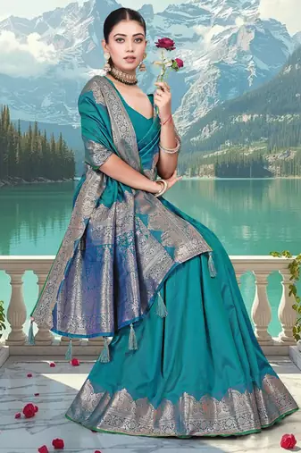 banarasi teal silk blend saree with golden zari border work and tassels with blouse