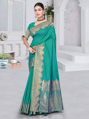 banarasi rama silk blend saree with golden zari border work and tassels with blouse 1