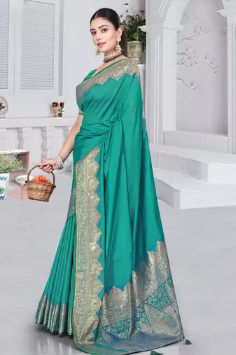 banarasi rama silk blend saree with golden zari border work and tassels with blouse