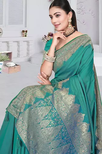 banarasi rama silk blend saree with golden zari border work and tassels with blouse