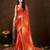 orange women bandhani printed embellished saree