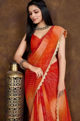 orange women bandhani printed embellished saree