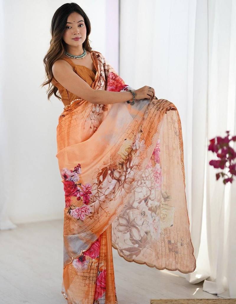 Orange floral kutchi embroidery silk blend saree