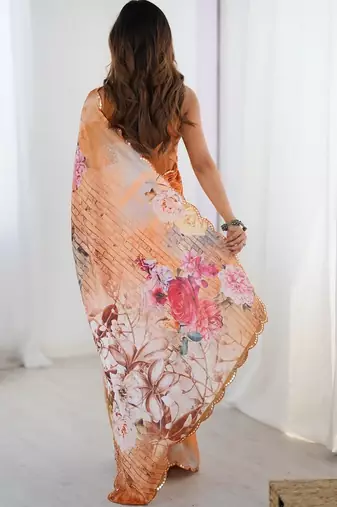 Orange floral kutchi embroidery silk blend saree
