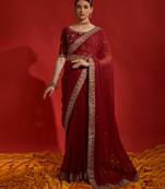 Red ethnic motifs sequinned  saree