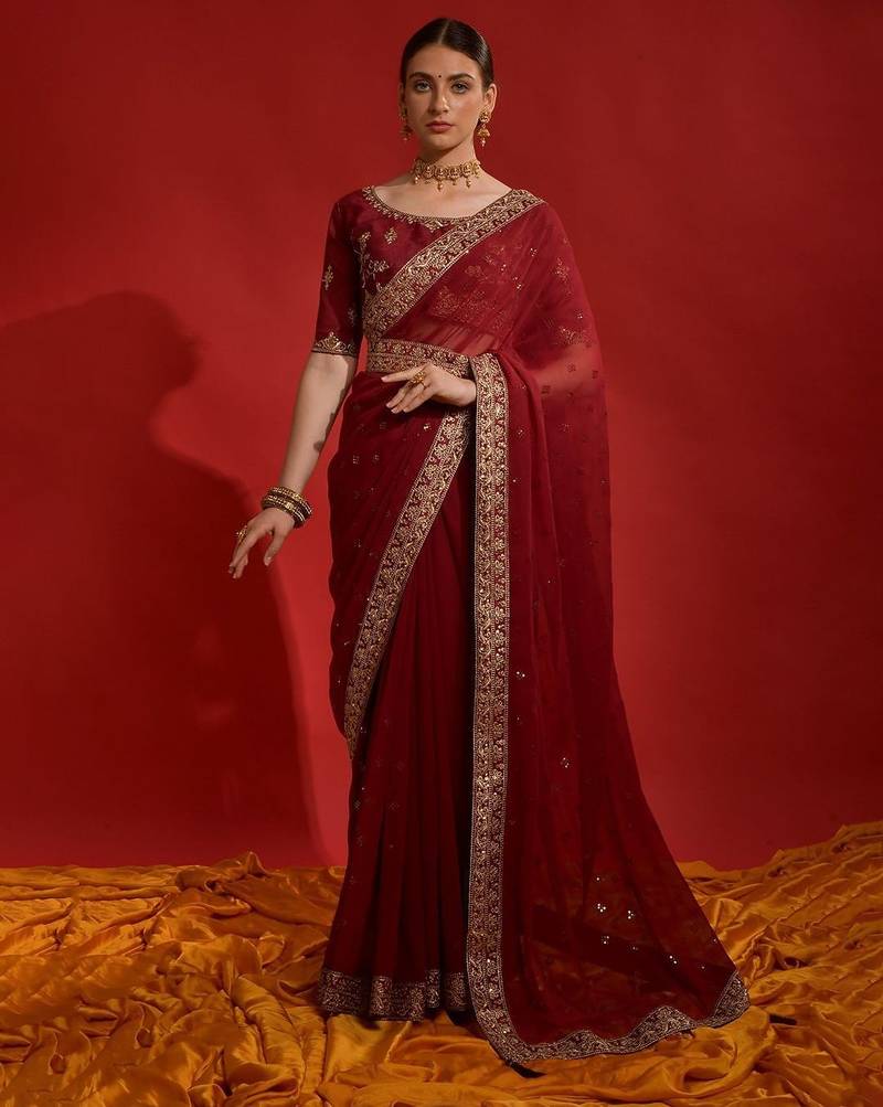 Red ethnic motifs sequinned  saree