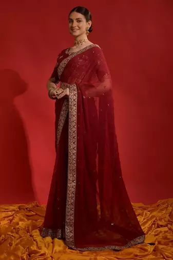 Red ethnic motifs sequinned  saree