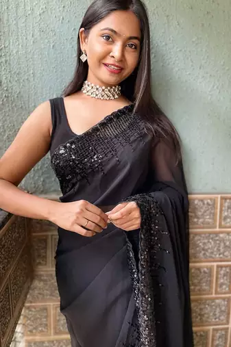 black sequinned poly georgette saree with blouse piece