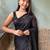 black sequinned poly georgette saree with blouse piece
