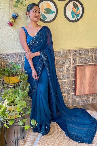 teal sequinned poly georgette saree with blouse piece