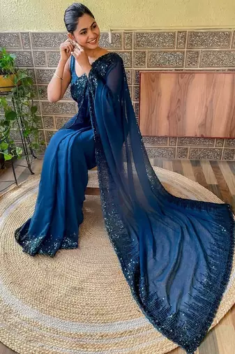 teal sequinned poly georgette saree with blouse piece