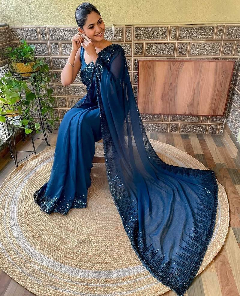 teal sequinned poly georgette saree with blouse piece