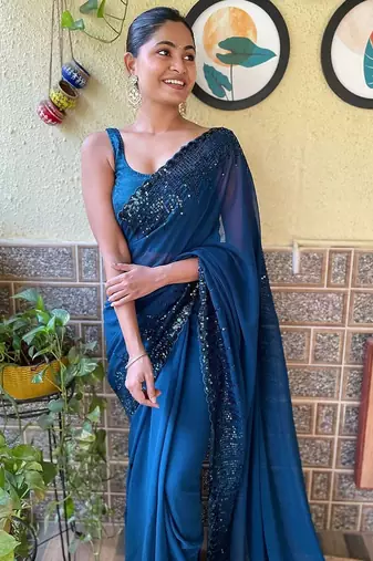 teal sequinned poly georgette saree with blouse piece