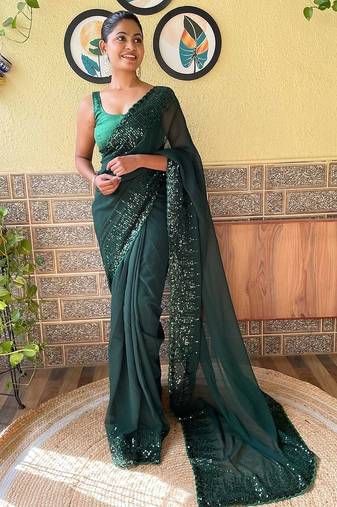 green sequinned poly georgette saree with blouse piece
