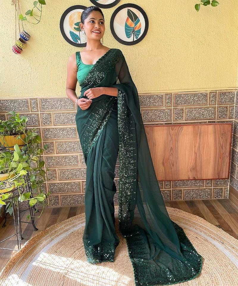 green sequinned poly georgette saree with blouse piece