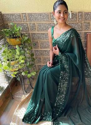 green sequinned poly georgette saree with blouse piece 2