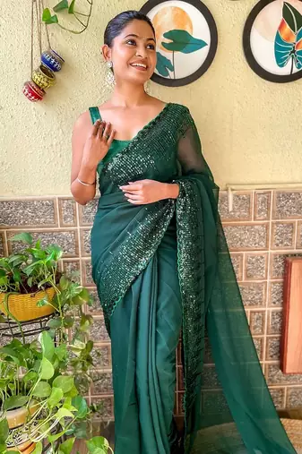 green sequinned poly georgette saree with blouse piece