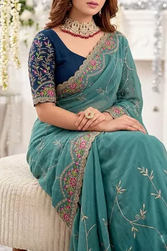 teal floral embroidered poly georgette heavy work saree