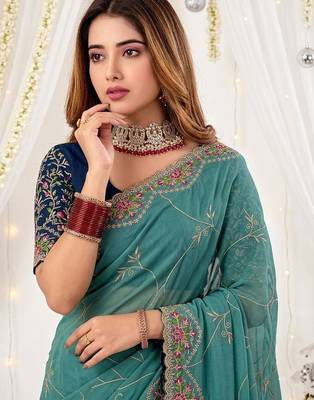 teal floral embroidered poly georgette heavy work saree 4