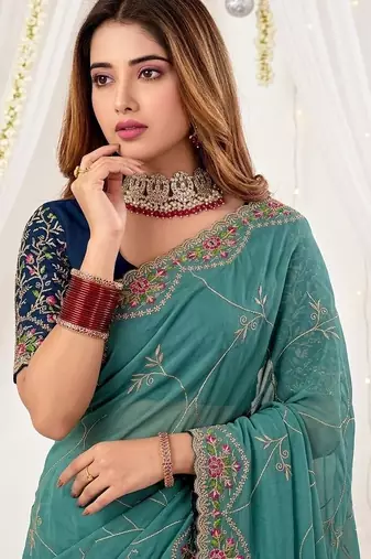 teal floral embroidered poly georgette heavy work saree