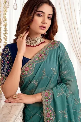 teal floral embroidered poly georgette heavy work saree