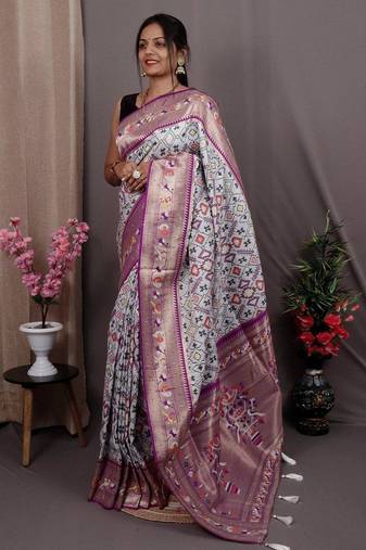 white blue & gold-toned ethnic motif woven design zari patola saree