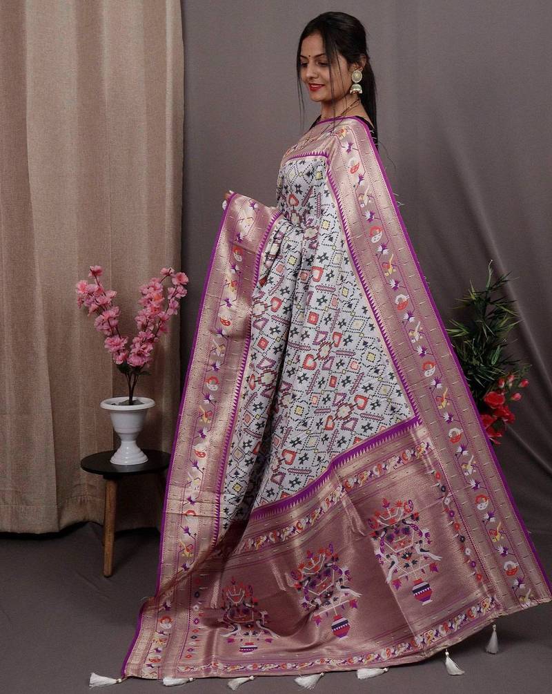 white blue & gold-toned ethnic motif woven design zari patola saree