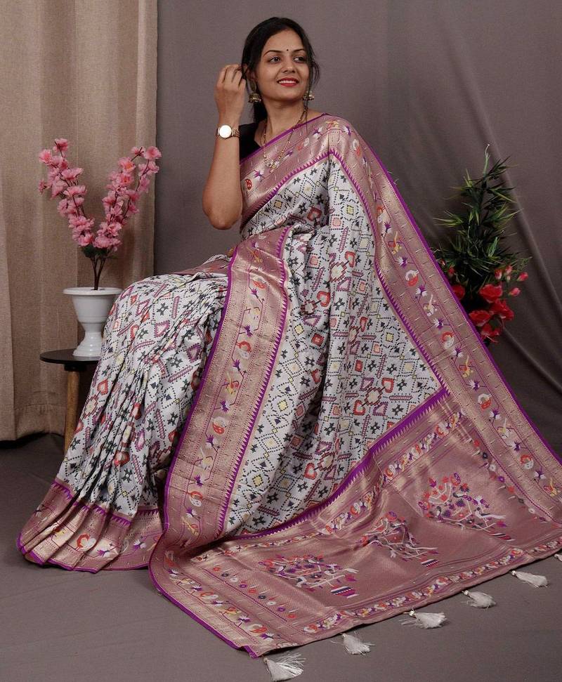 white blue & gold-toned ethnic motif woven design zari patola saree