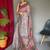 pink ethnic motif printed saree