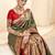 green woven design zari paithani saree