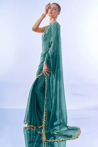 teal sequinned organza saree with blouse piece