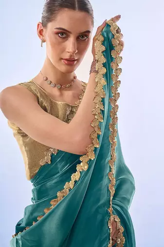 teal sequinned organza saree with blouse piece