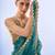 teal sequinned organza saree with blouse piece
