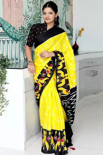 yellow ethnic motifs printed ikat saree