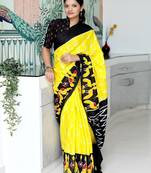 yellow ethnic motifs printed ikat saree