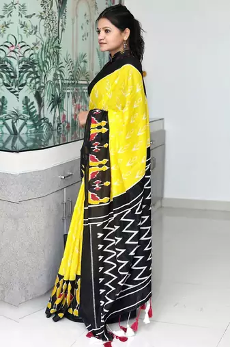 yellow ethnic motifs printed ikat saree